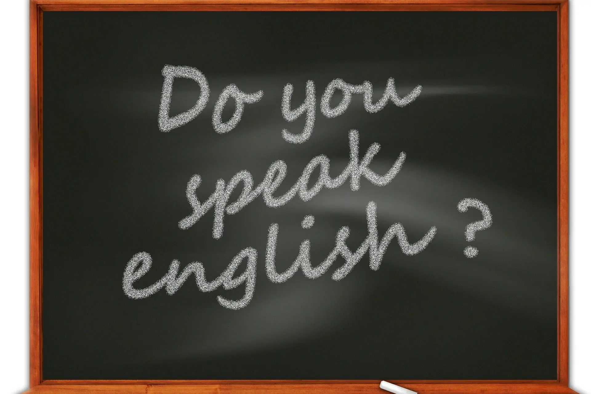 liitutaulu, jossa lukee englanniksi Do you speak english?